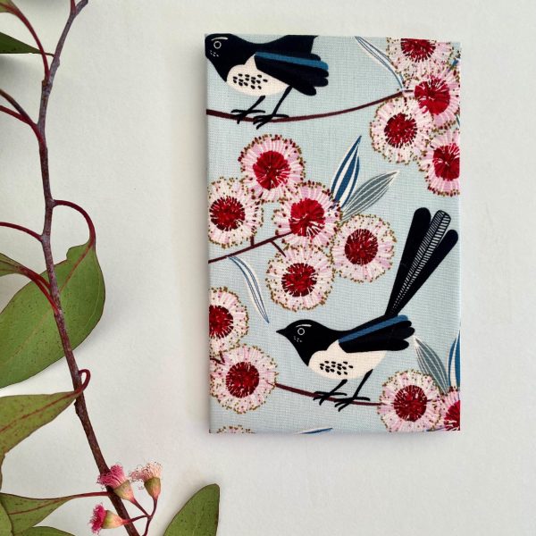 A cotton handkerchief featuring Willy Wagtails and eucalyptus blossom.