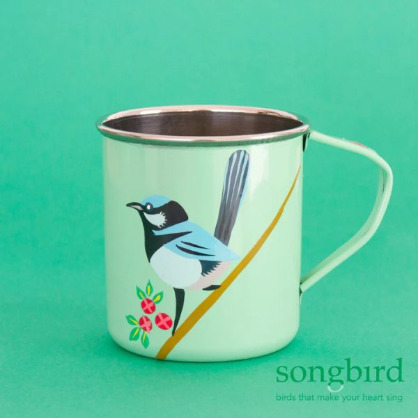 A light green metal mug with handpainted artwork of a Superb Fairy-wren next to leaves and flowers. There is a watermark logo from the manufacturer, Songbird Collection, in the bottom right-hand corner.